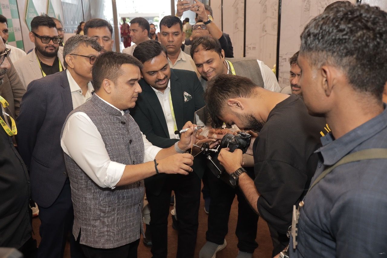 Dignitaries signing at an inauguration with Parv Parmar